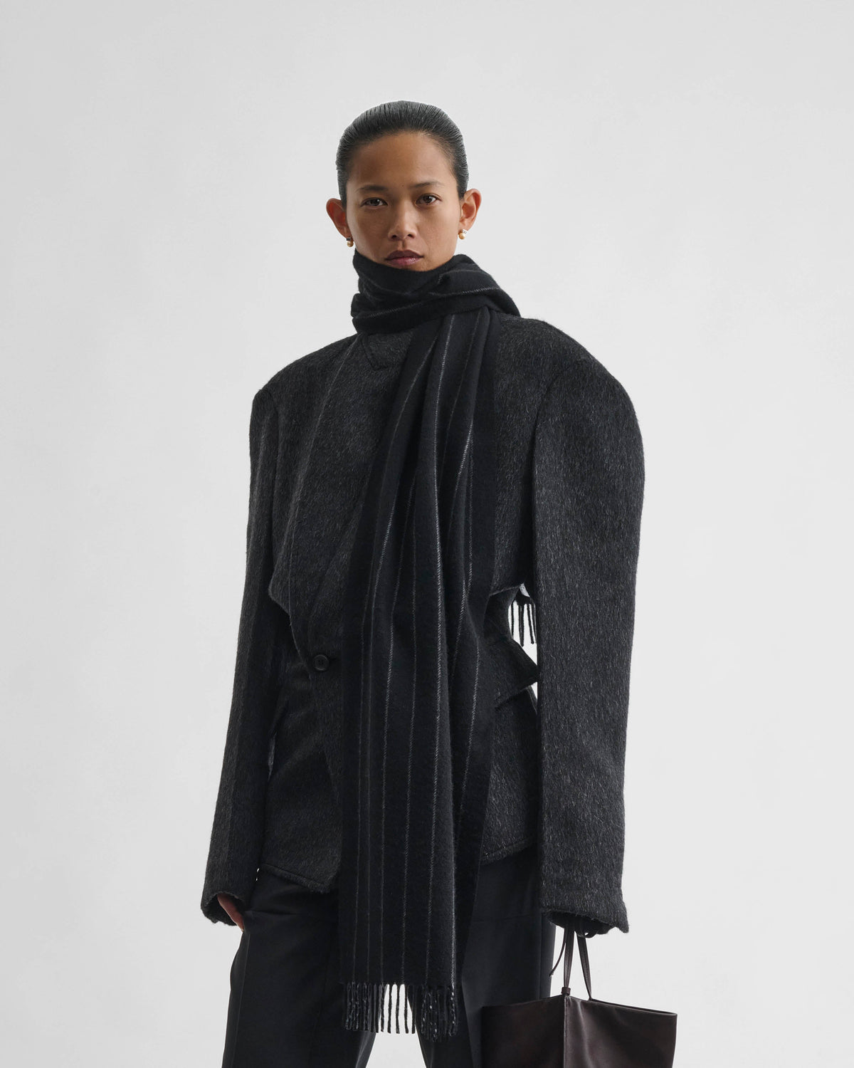 Front view of model wearing PINSTRIPE SCARF in black ash wool