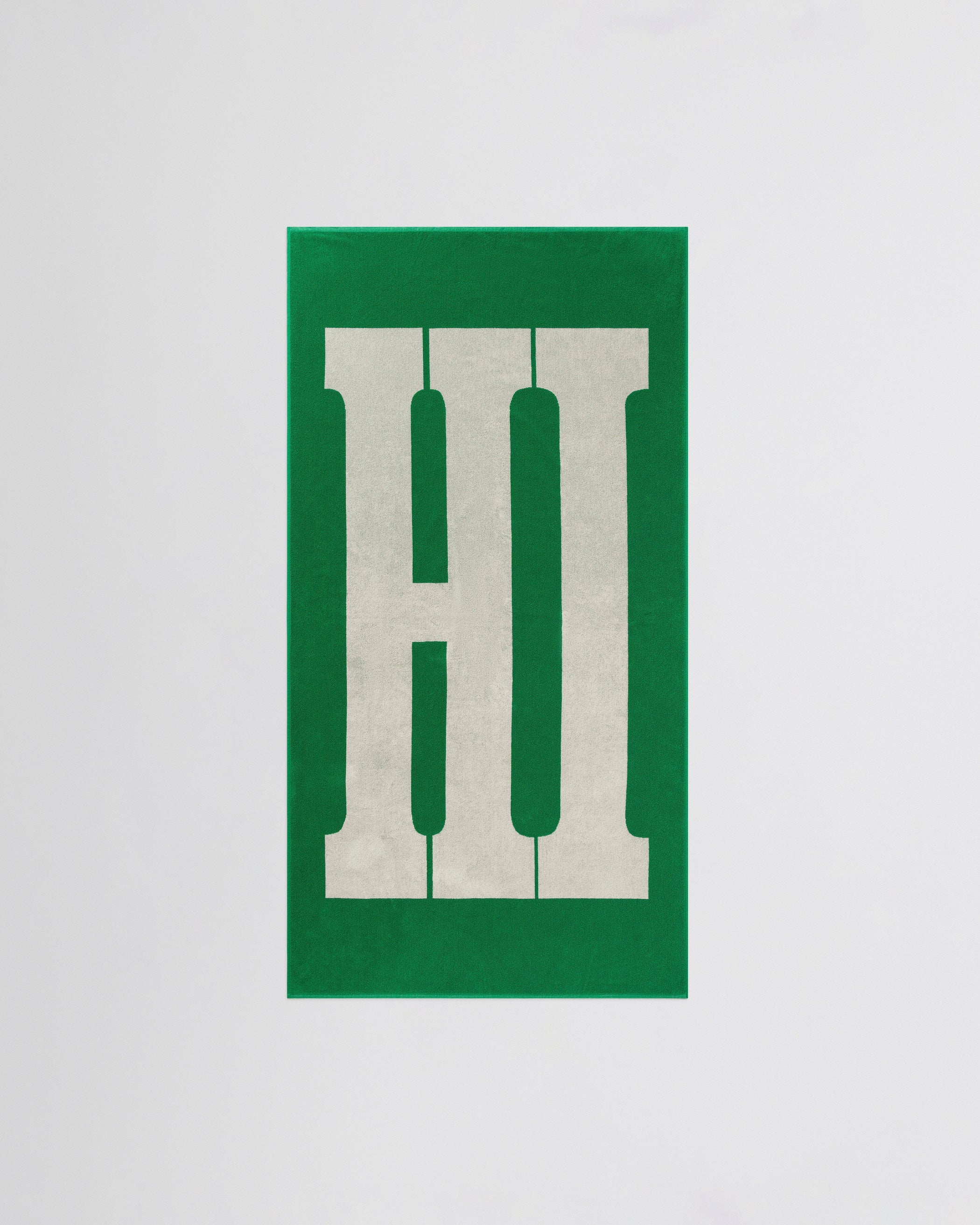 Flat front view of HI TOWEL in electric green cotton