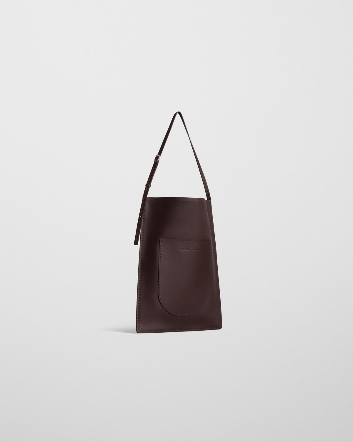 Angled front view of GLOVE MESSENGER BAG in oxblood leather