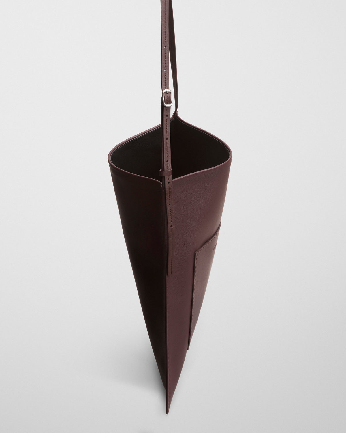Side view of GLOVE MESSENGER BAG in oxblood leather