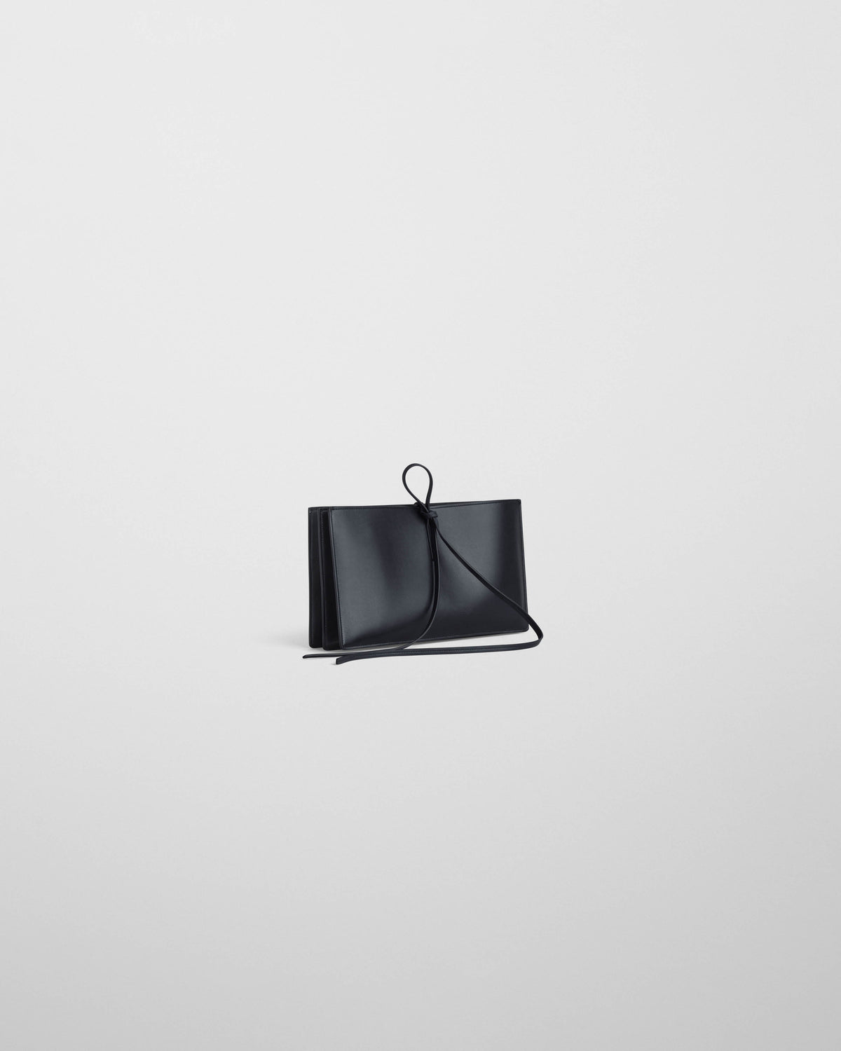Side view of SPLAY CLUTCH in dark navy leather