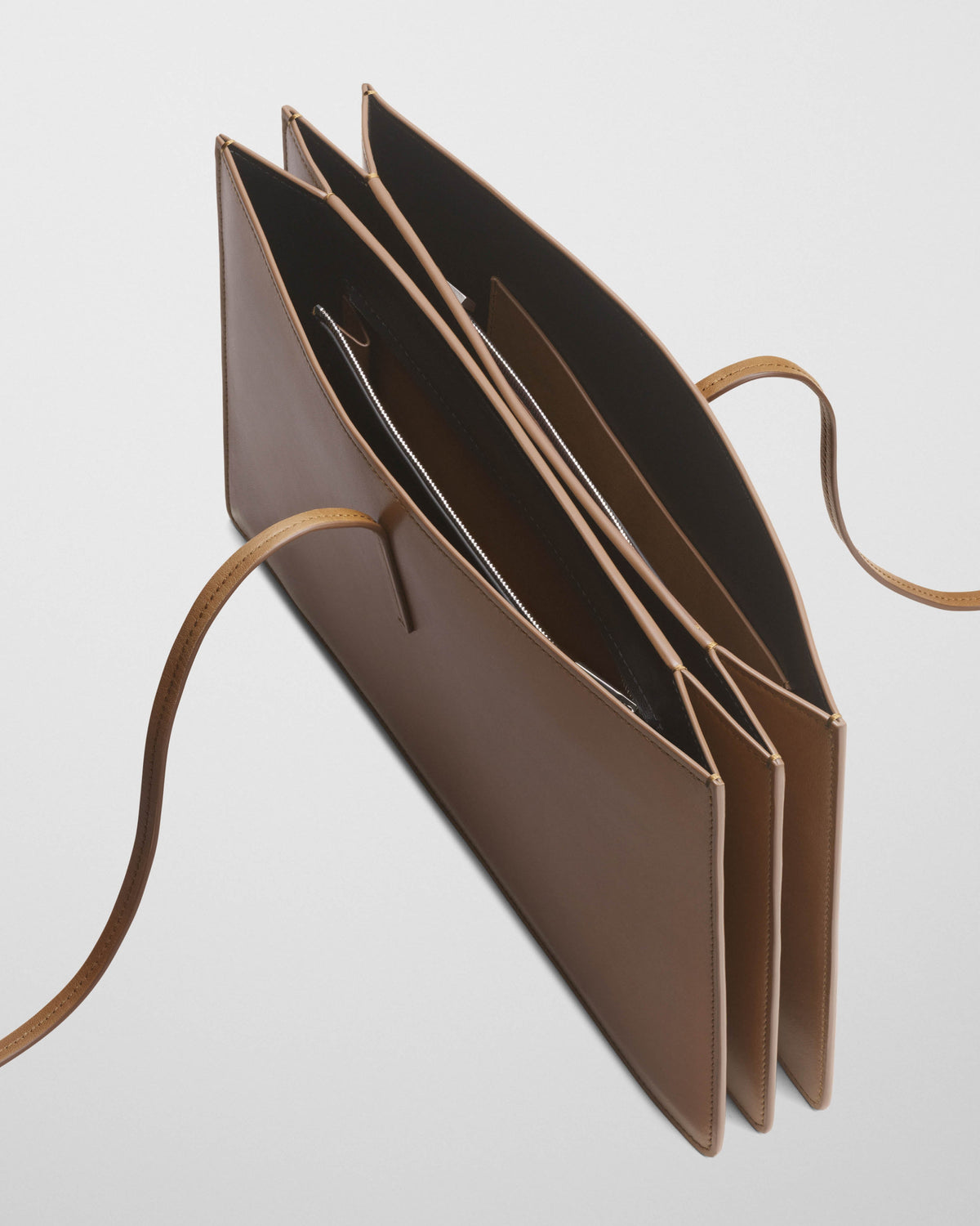 Detail view of SPLAY CLUTCH in bronze leather
