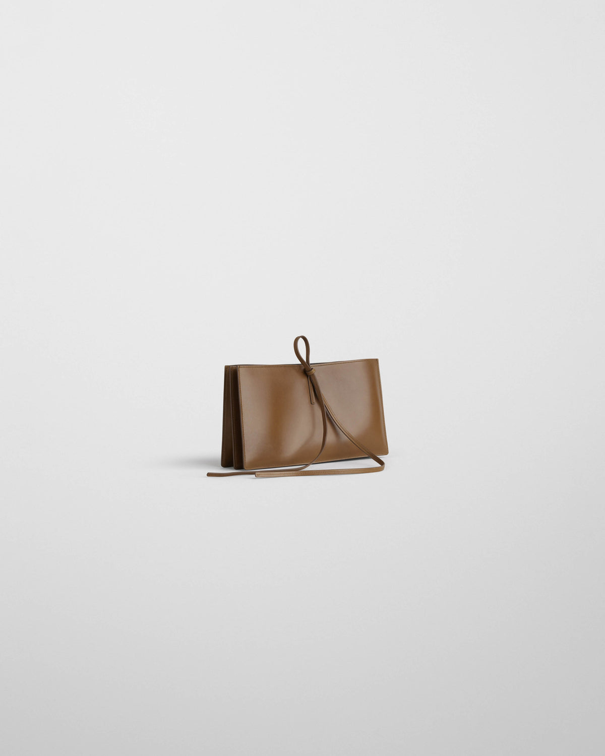 Side view of SPLAY CLUTCH in bronze leather