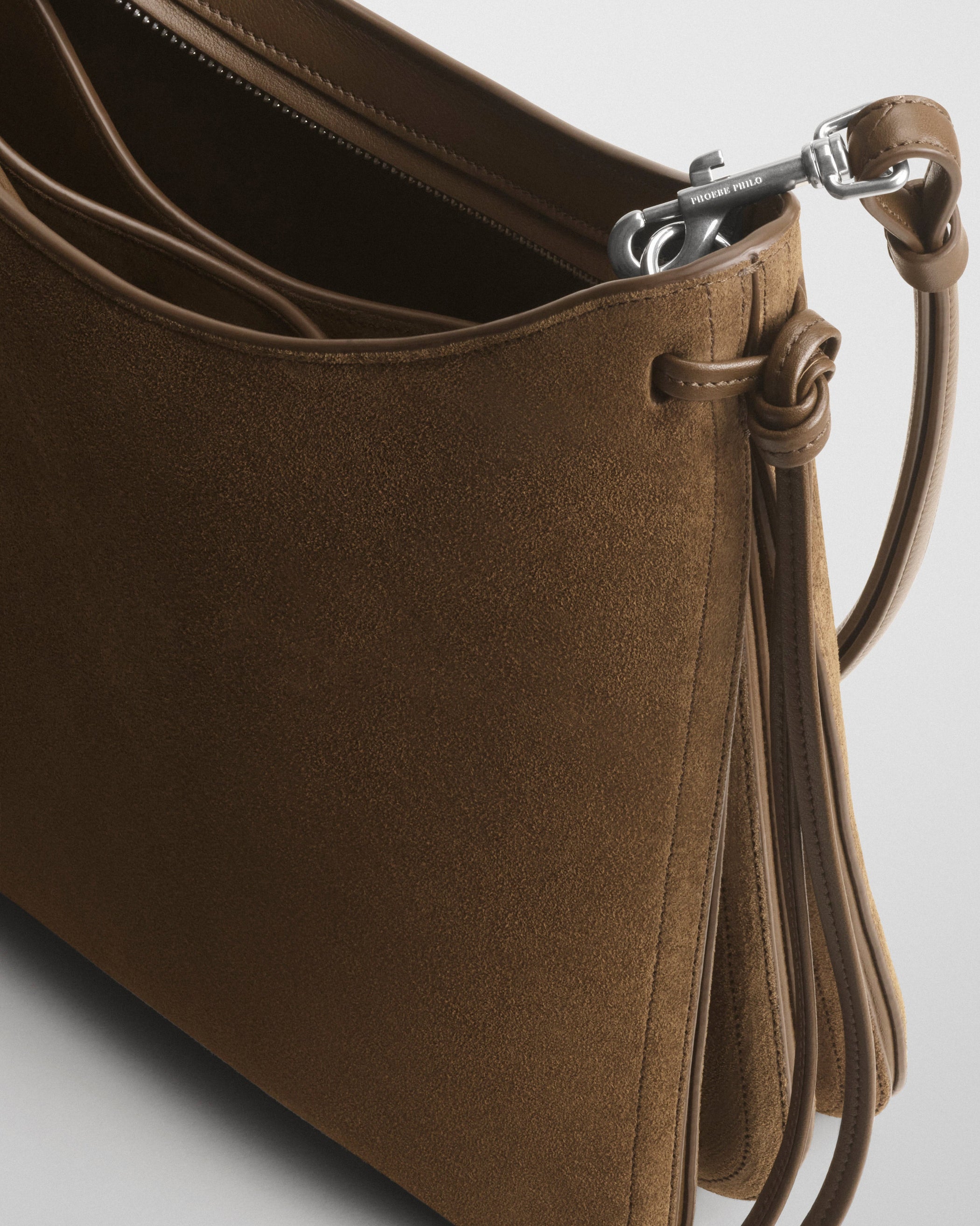 Detail view of GIG BAG in khaki suede