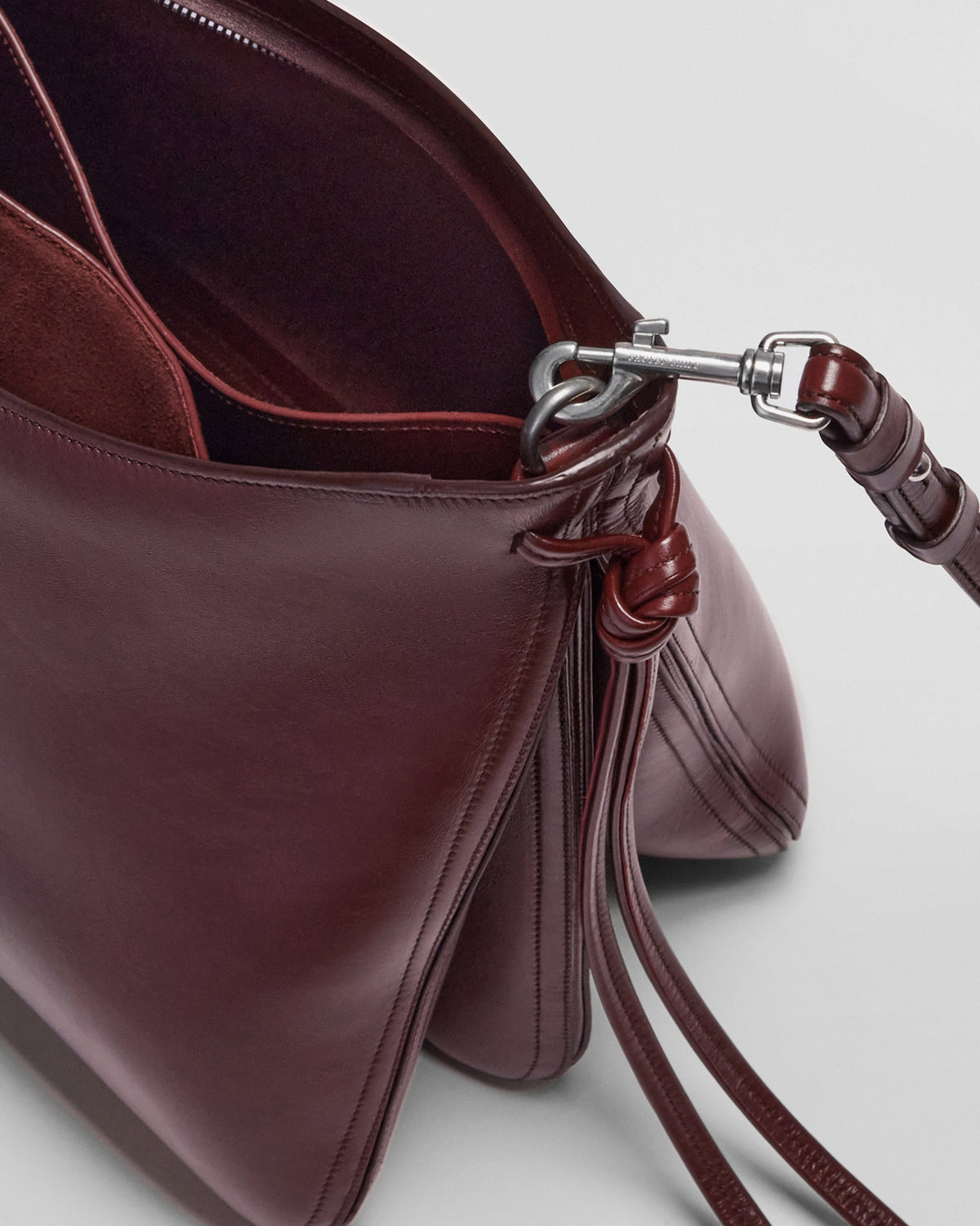 Detail view of GIG BAG in oxblood leather
