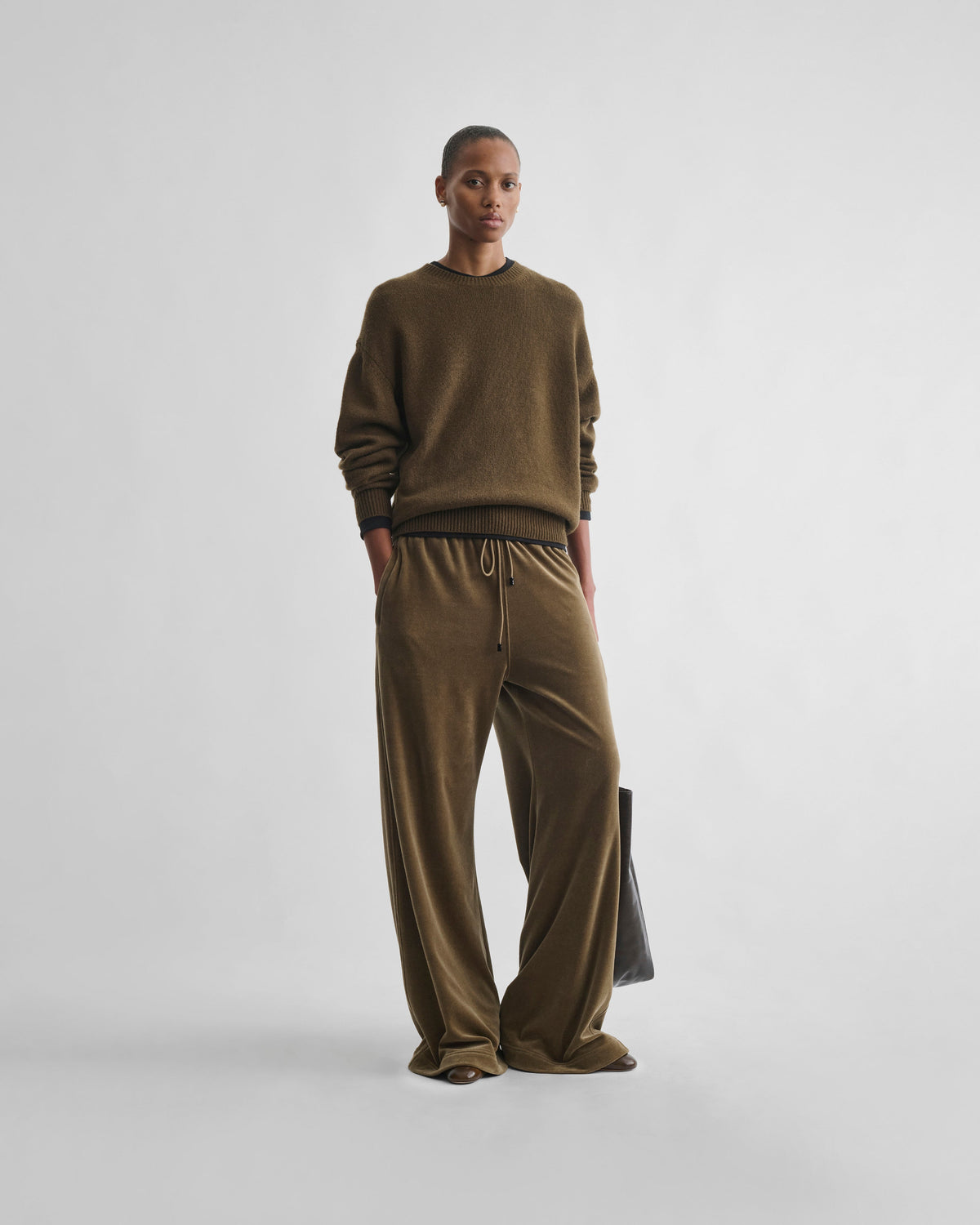 Front view of model wearing VELVETEEN JOGGERS in bronze velour