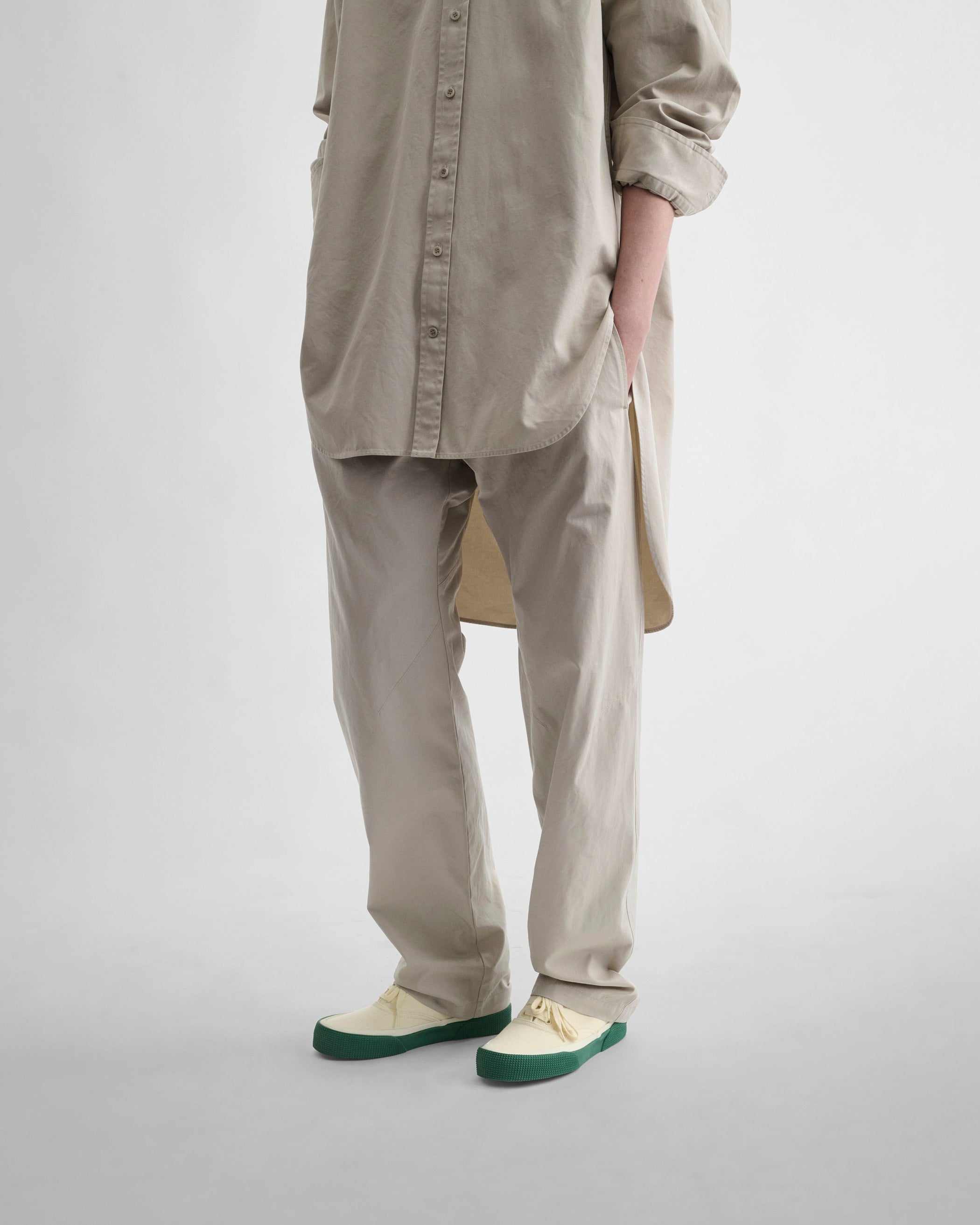 Front detail view model wearing ARCH TROUSERS in gum cotton