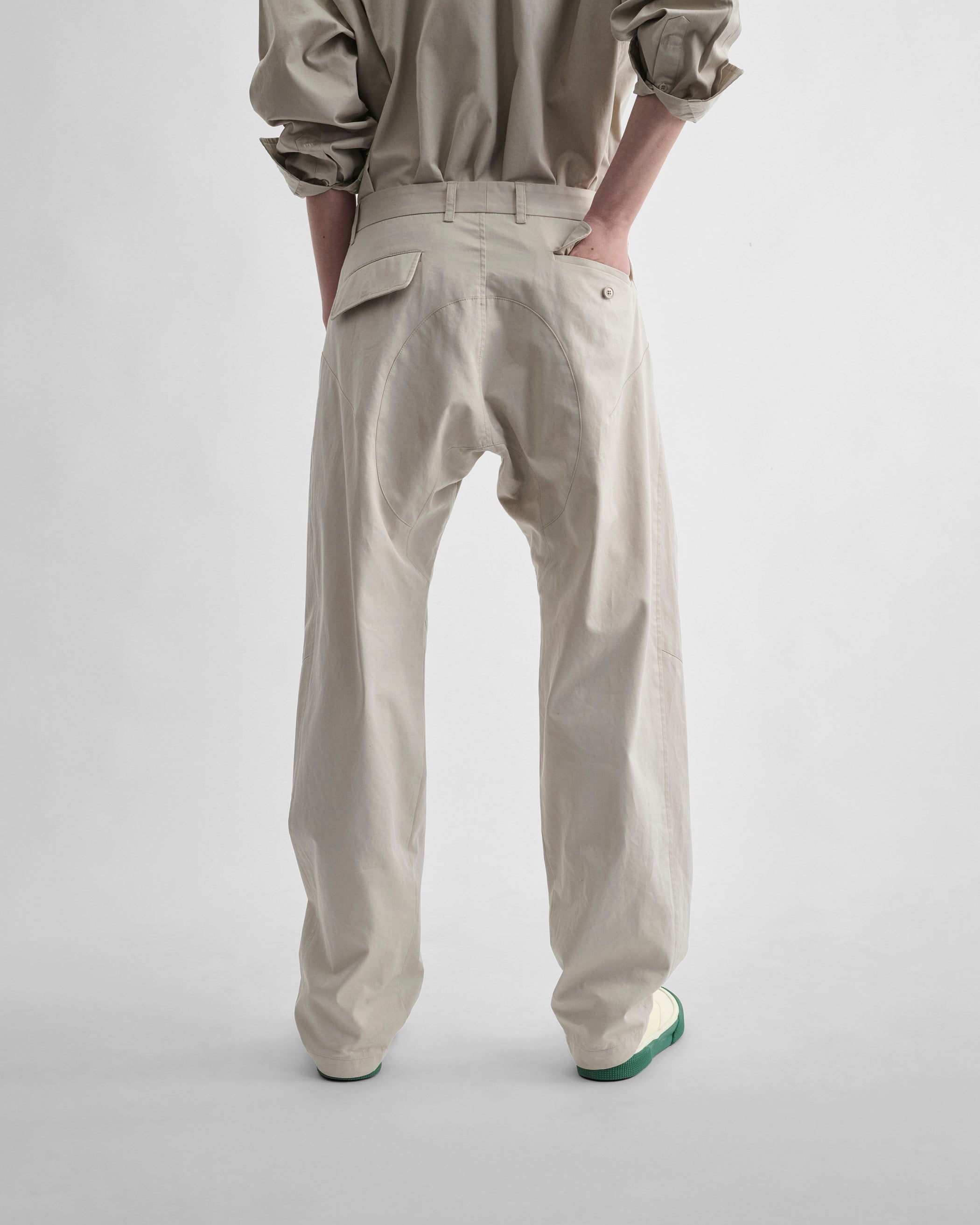 Back view model wearing ARCH TROUSERS in gum cotton
