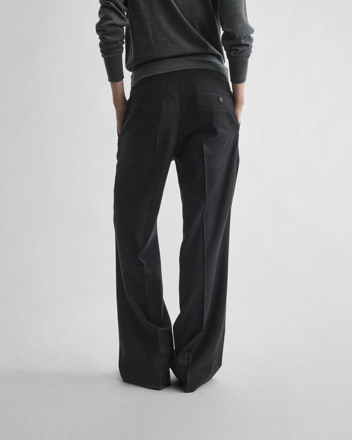 Back view of model wearing BOYISH TROUSERS in charcoal wool