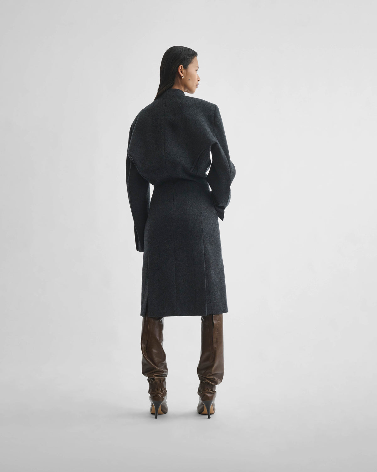 Back shot of model wearing KINKED TAILORED DRESS in anthracite wool cashmere