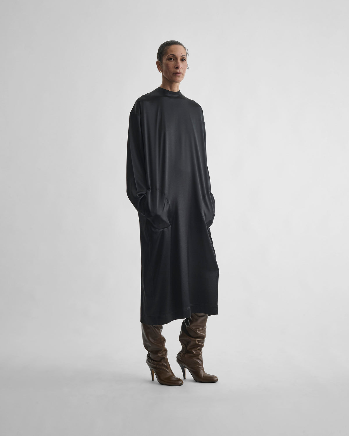 Front view of model wearing CREW NECK DRESS in black silk