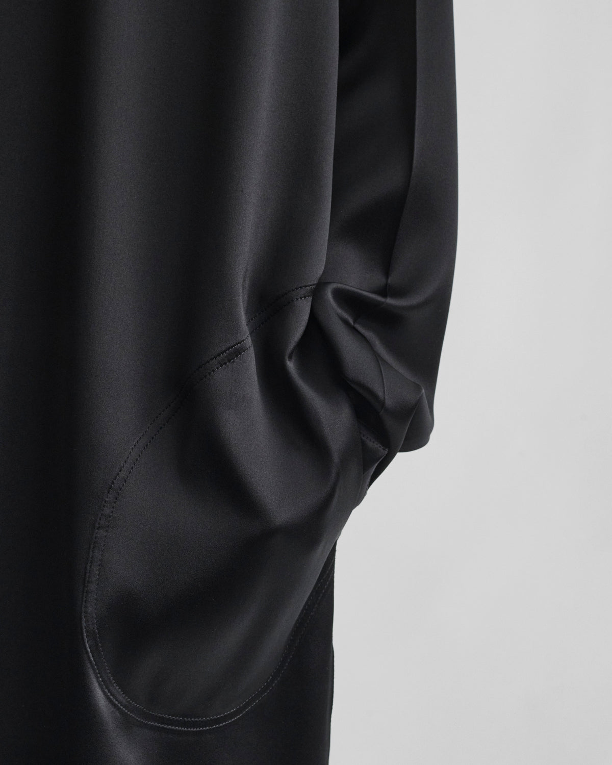 Detail shot of CREW NECK DRESS in black silk