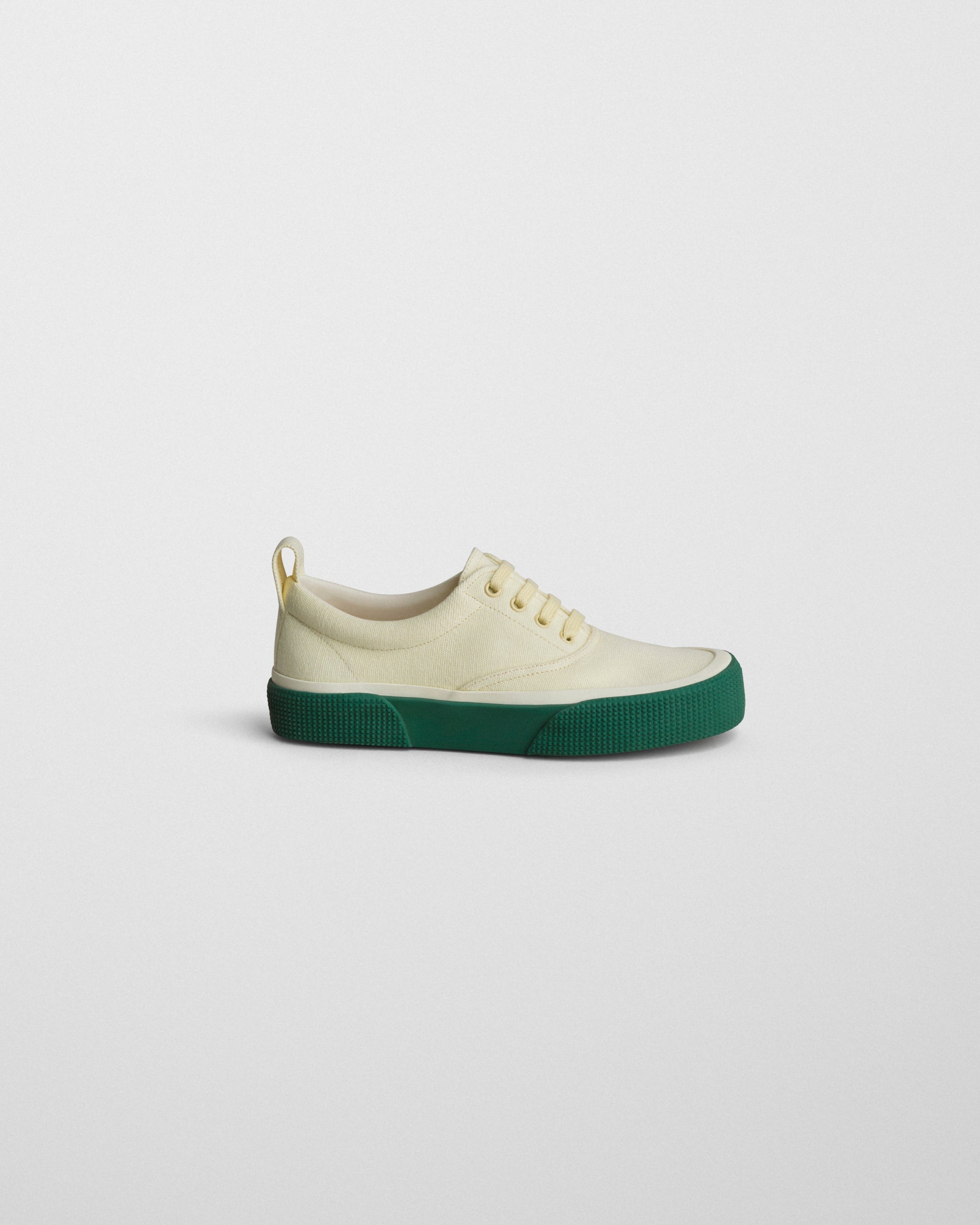 Side view of PLIMSOLE in soft yellow canvas