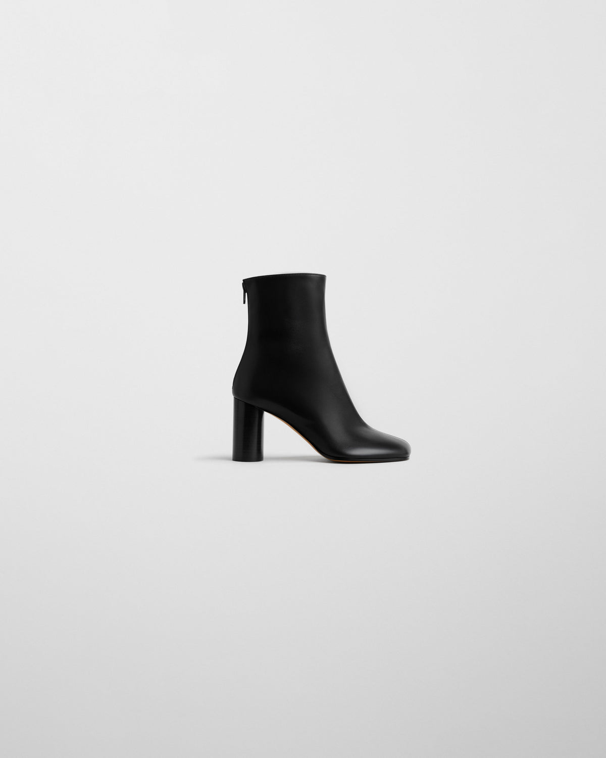 Side view of TUG ANKLE BOOT in black leather