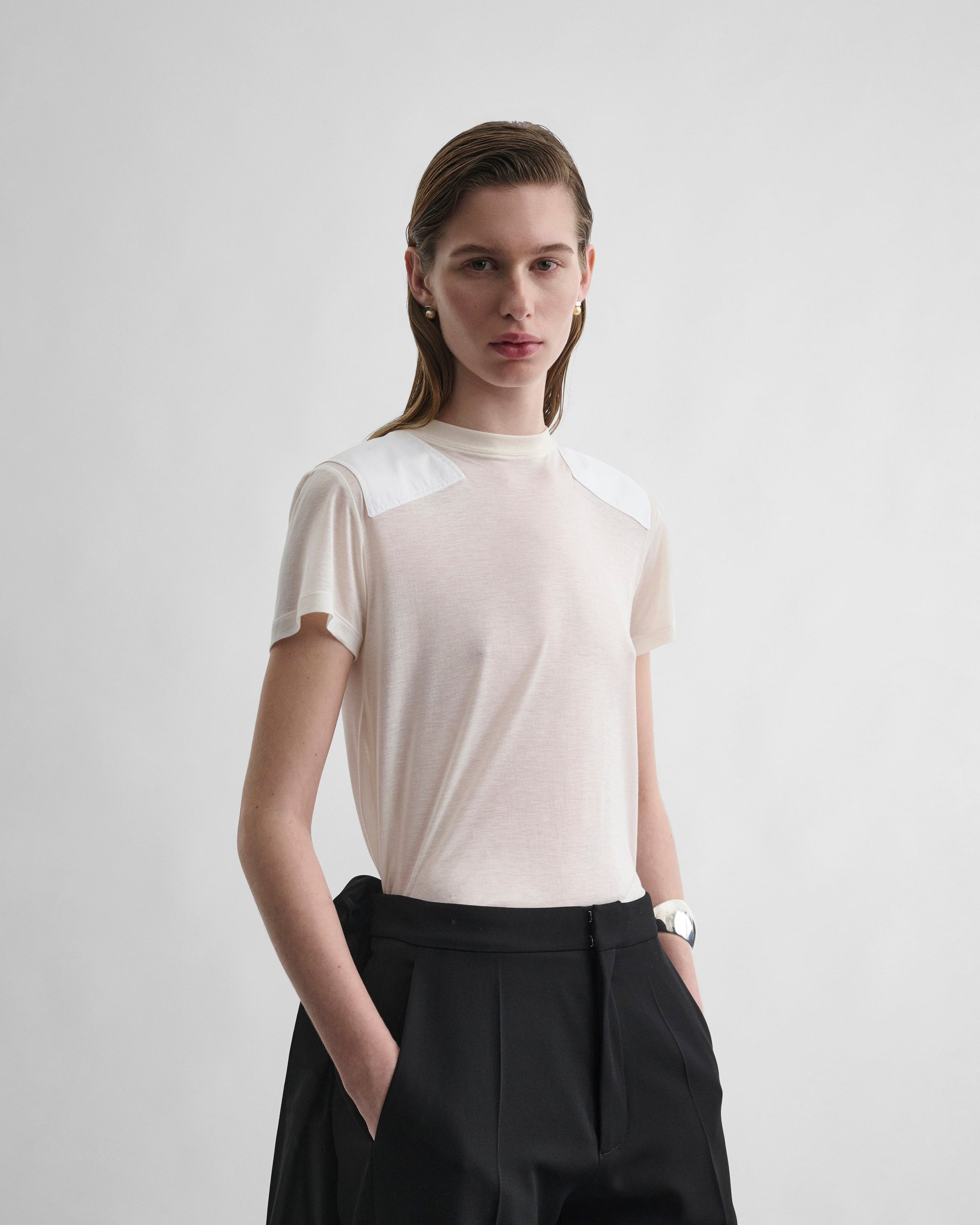 Front view of model wearing PATCH T-SHIRT in acid ivory cotton