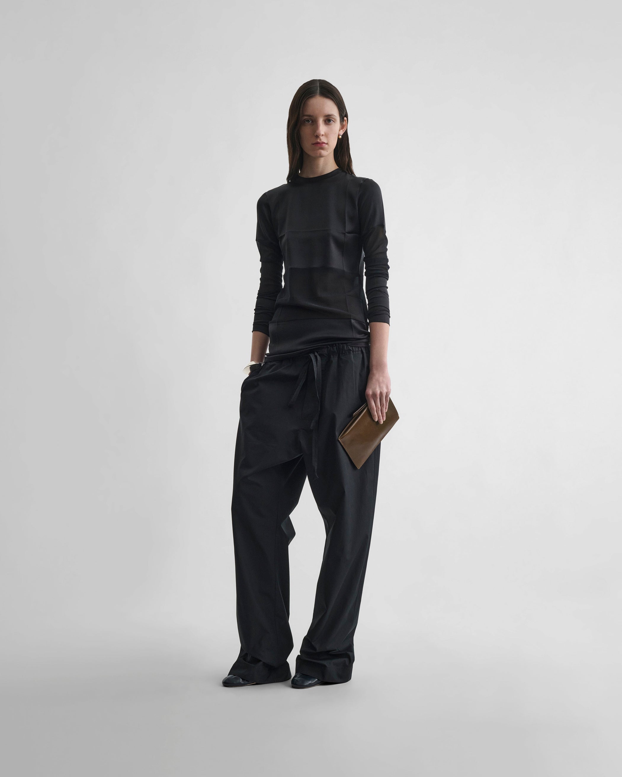 Front view of model wearing PANEL TOP in black silk
