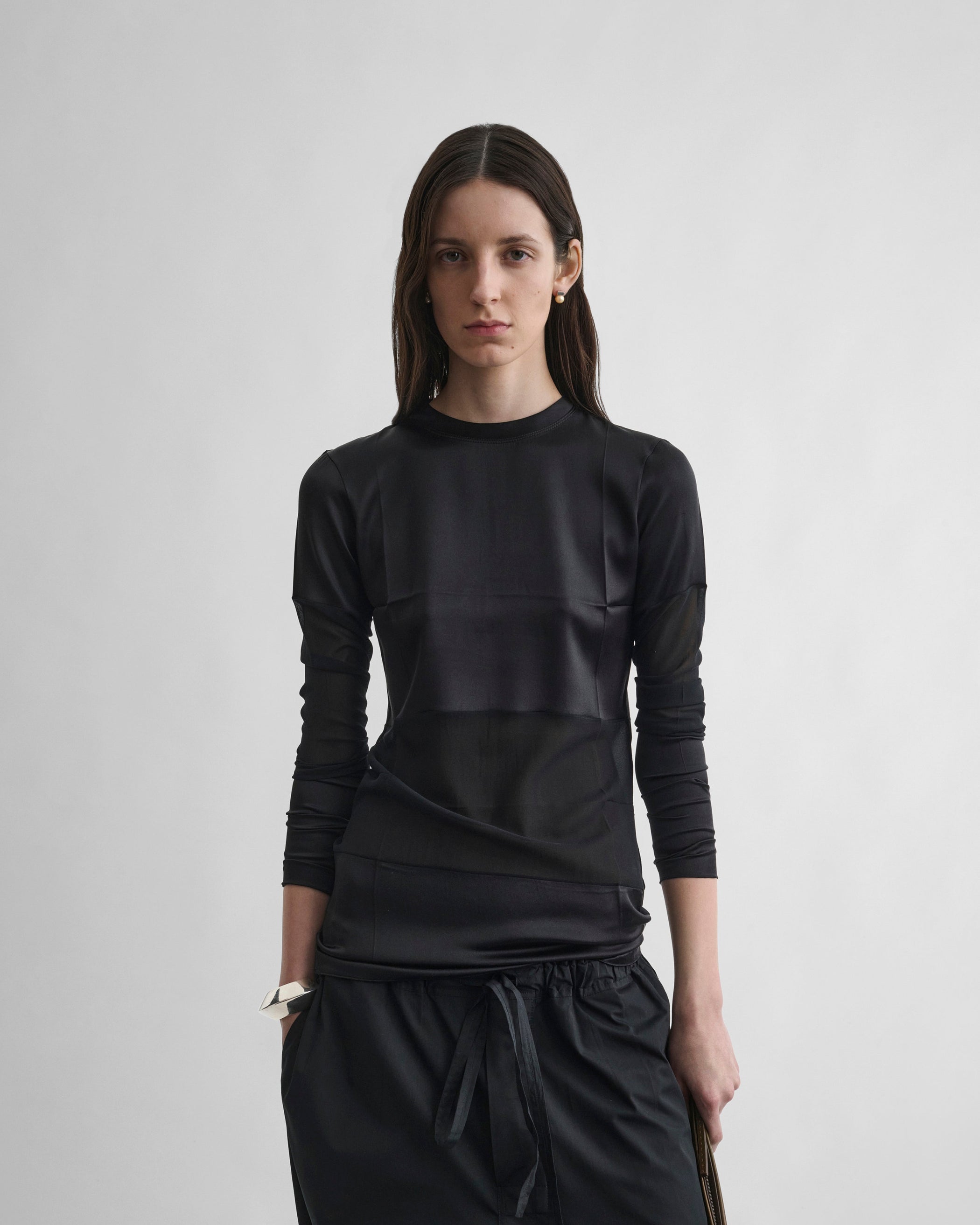 Front view of model wearing PANEL TOP in black silk