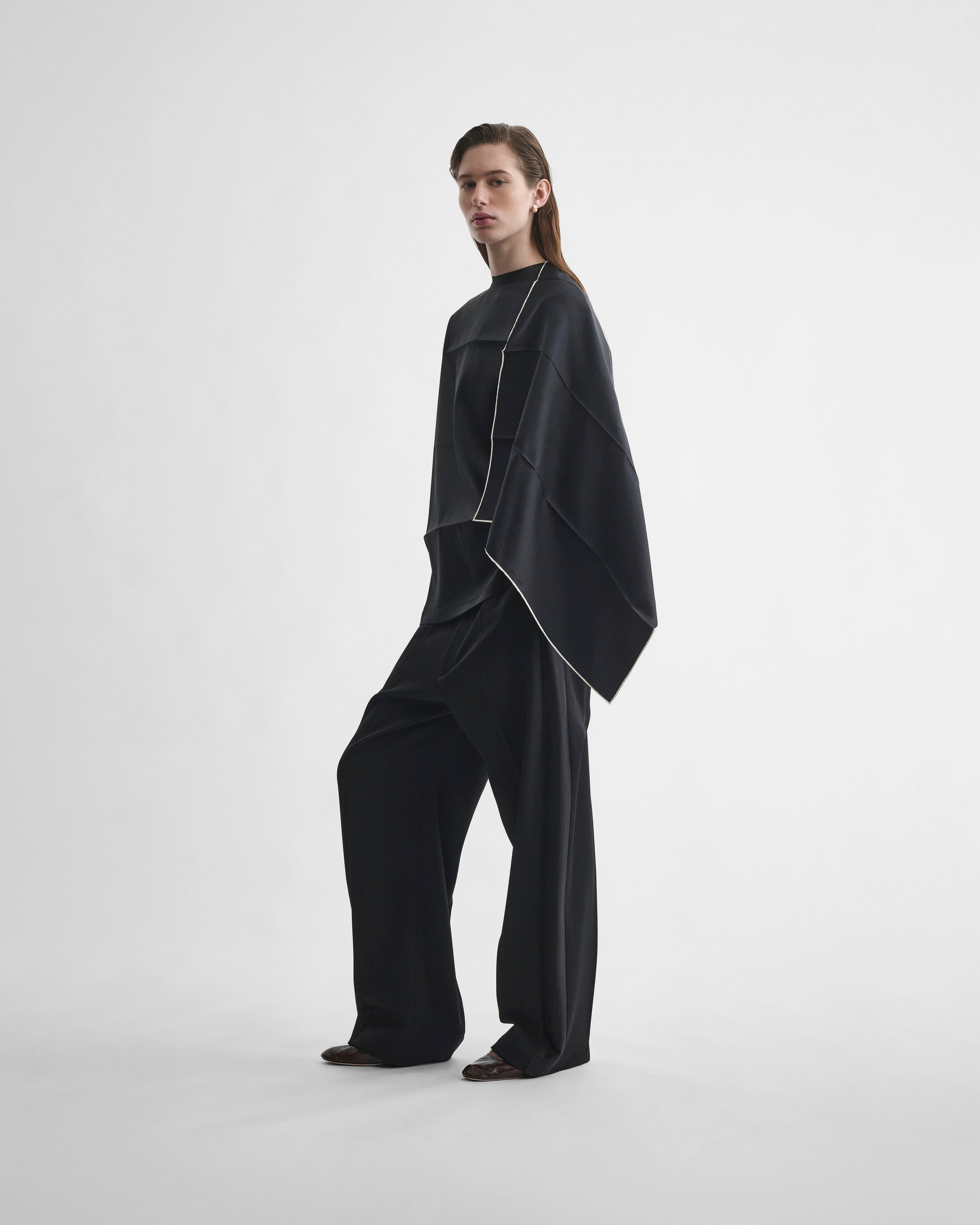 Side view of model wearing SCARF TOP in black silk