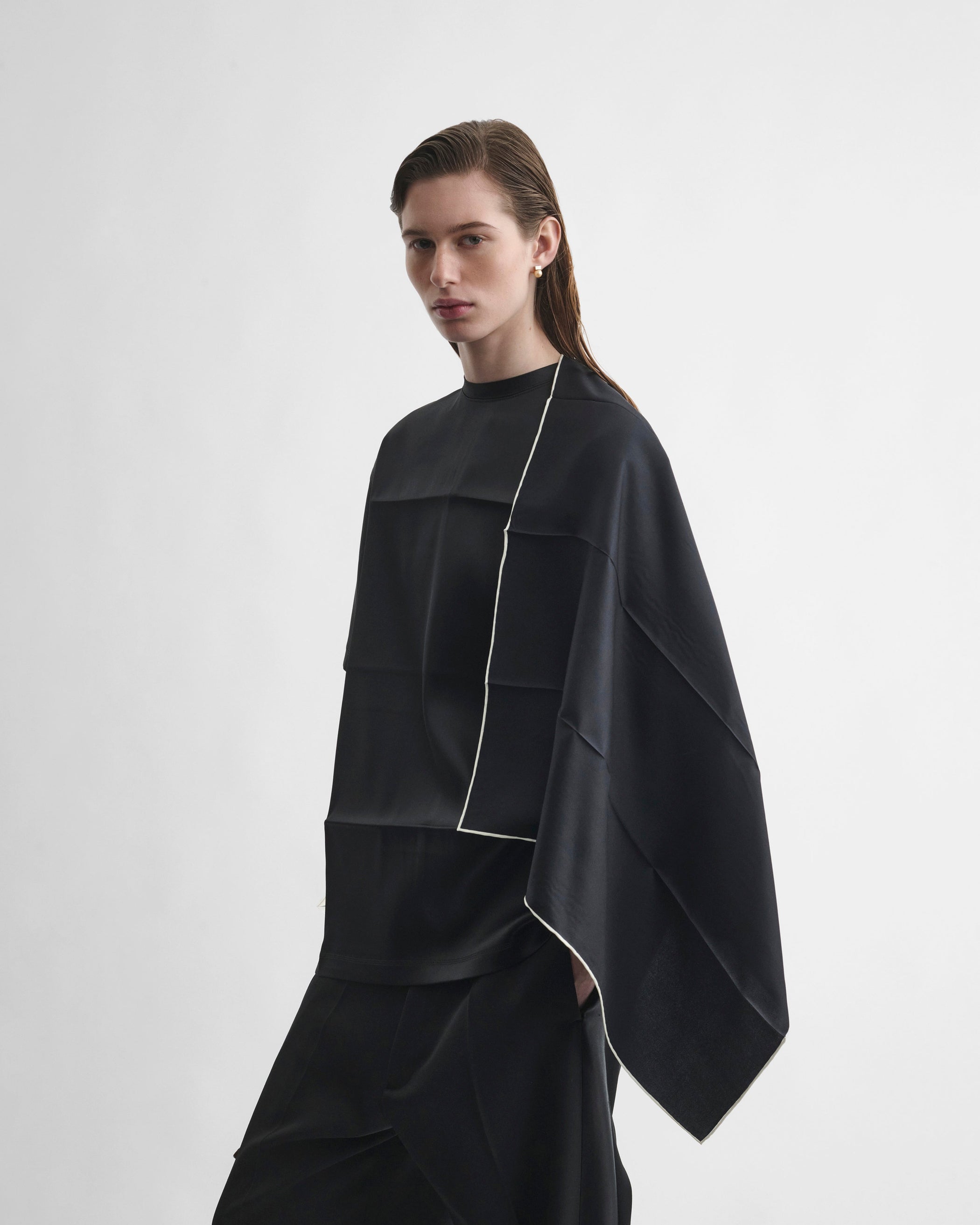 Front view of model wearing SCARF TOP in black silk