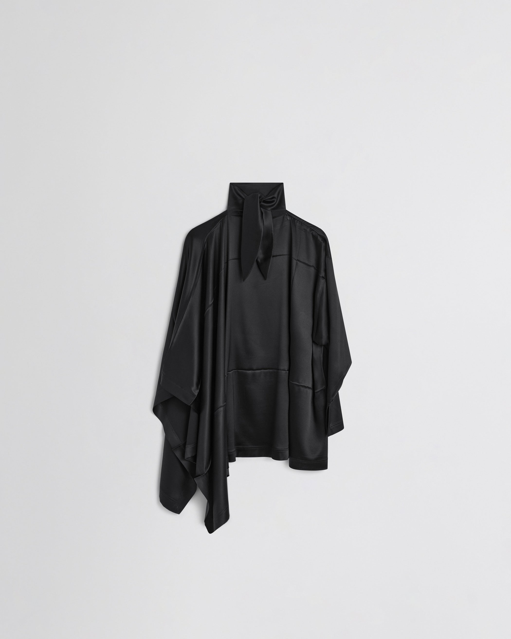 Flat back view of CAPED TOP in black silk