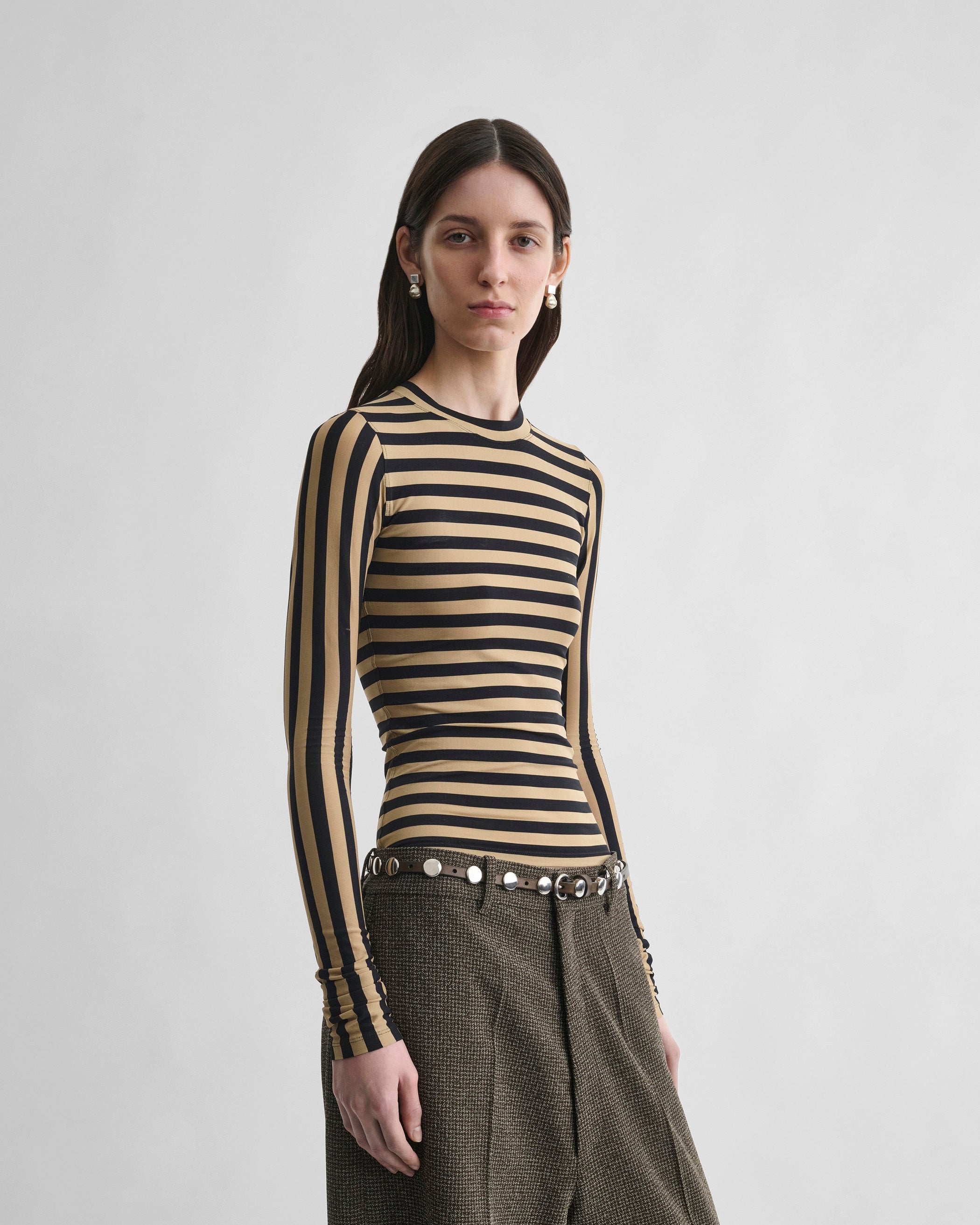 Front view of model wearing STRIPE TOP in toffee/black viscose
