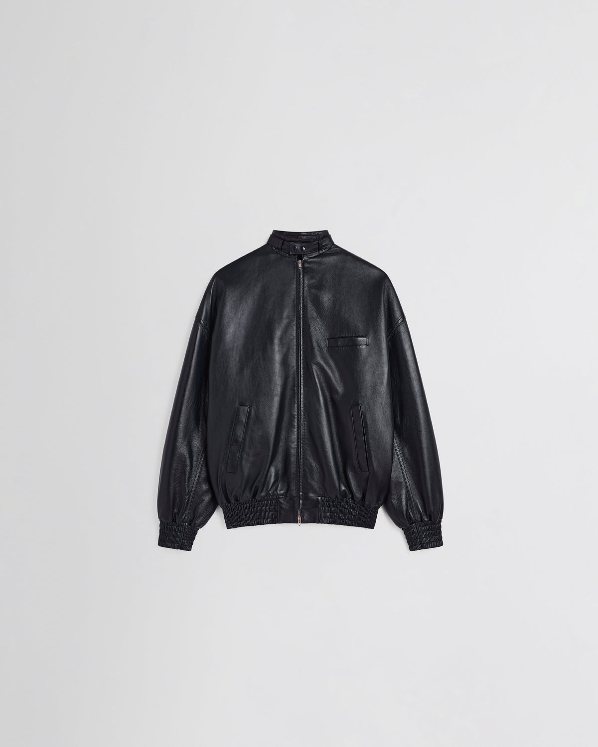 Front view of Front view of model wearing CLASSIC BOMBER in black ink leather